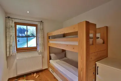 Ein Bett oder Betten in einem Zimmer der Unterkunft Alpboden