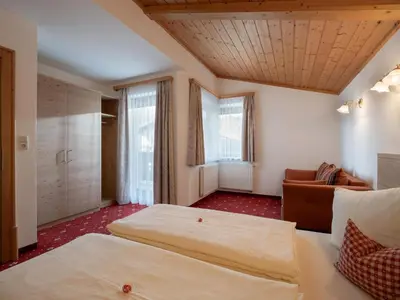 Ein Bett oder Betten in einem Zimmer der Unterkunft Landhaus Alpina