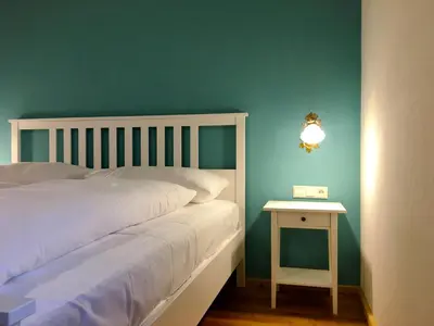 Ein Bett oder Betten in einem Zimmer der Unterkunft Ferienwohnung Remise am Reitl