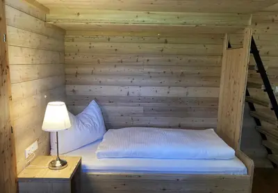 Ein Bett oder Betten in einem Zimmer der Unterkunft Ferienwohnung Remise am Reitl