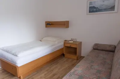 Ein Bett oder Betten in einem Zimmer der Unterkunft Die Pension - Margreiter