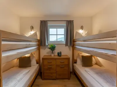 Ein Bett oder Betten in einem Zimmer der Unterkunft Tauernlodge Krimml 2B