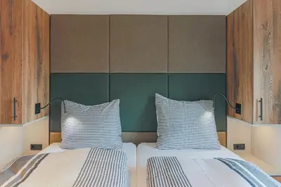 Ein Bett oder Betten in einem Zimmer der Unterkunft Residenz Brixental Top 7