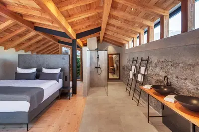 Ein Bett oder Betten in einem Zimmer der Unterkunft Boutiquehotel Rattenberg