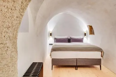 Ein Bett oder Betten in einem Zimmer der Unterkunft Boutiquehotel Rattenberg