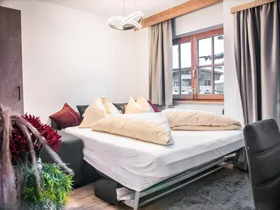Ein Bett oder Betten in einem Zimmer der Unterkunft La Tombola Appartements