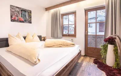 Ein Bett oder Betten in einem Zimmer der Unterkunft La Tombola Appartements