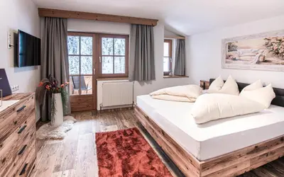 Ein Bett oder Betten in einem Zimmer der Unterkunft La Tombola Appartements