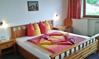Ein Bett oder Betten in einem Zimmer der Unterkunft Ferienwohnung Dengg