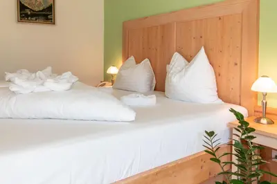 Ein Bett oder Betten in einem Zimmer der Unterkunft dasKAISER - Dein Gartenhotel in Tirol