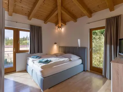 Ein Bett oder Betten in einem Zimmer der Unterkunft Ferienwohnung Pacher