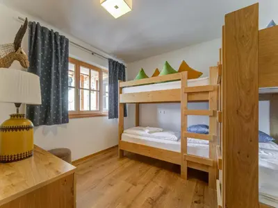 Ein Bett oder Betten in einem Zimmer der Unterkunft Chalet in Mittersill by Ski Lift & Sauna