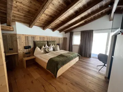 Ein Bett oder Betten in einem Zimmer der Unterkunft Penthouse Tauernfenster, Neukirchen