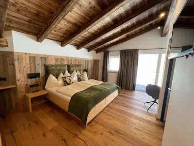Ein Bett oder Betten in einem Zimmer der Unterkunft Penthouse Tauernfenster, Neukirchen