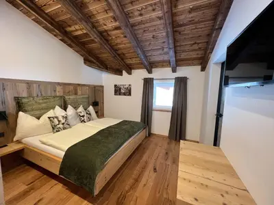 Ein Bett oder Betten in einem Zimmer der Unterkunft Penthouse Tauernfenster, Neukirchen
