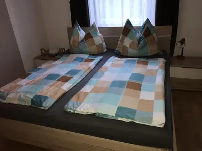 Ein Bett oder Betten in einem Zimmer der Unterkunft Alpin Apart Armin