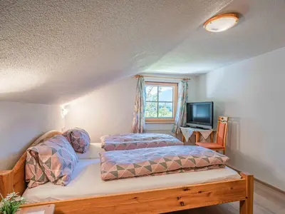 Ein Bett oder Betten in einem Zimmer der Unterkunft Landhaus Hotter 26