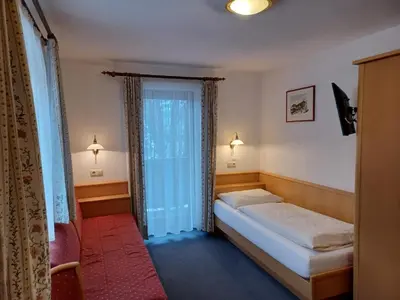 Ein Bett oder Betten in einem Zimmer der Unterkunft Wellness Pension Hollaus