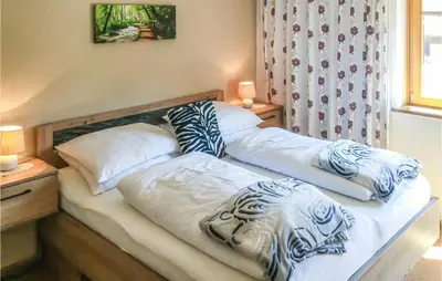 Ein Bett oder Betten in einem Zimmer der Unterkunft Große Ferienwohnung Muehlbach