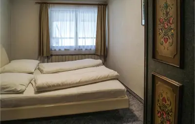 Ein Bett oder Betten in einem Zimmer der Unterkunft Schoene Ferienwohnung-Fuegen