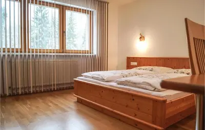 Ein Bett oder Betten in einem Zimmer der Unterkunft Ferienwohnung Im Eg-Niederau