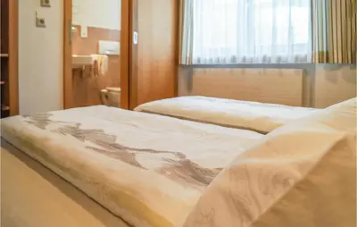 Ein Bett oder Betten in einem Zimmer der Unterkunft Schoene Ferienwohnung-Niederau