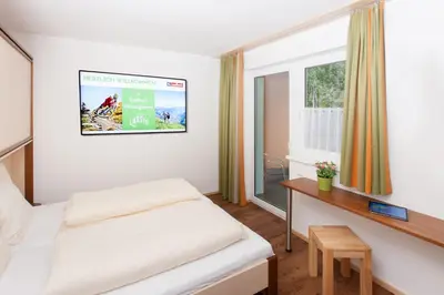 Ein Bett oder Betten in einem Zimmer der Unterkunft Landhaus Anni