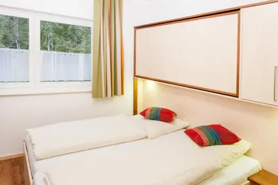Ein Bett oder Betten in einem Zimmer der Unterkunft Landhaus Anni