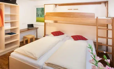 Ein Bett oder Betten in einem Zimmer der Unterkunft Landhaus Anni