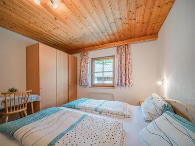 Ein Bett oder Betten in einem Zimmer der Unterkunft Landhaus Hotter 12