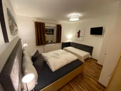 Ein Bett oder Betten in einem Zimmer der Unterkunft Ferienwohnung Wildkogelblick