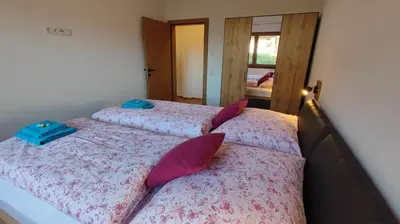 Ein Bett oder Betten in einem Zimmer der Unterkunft Apart Höllwarth