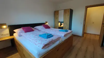Ein Bett oder Betten in einem Zimmer der Unterkunft Apart Höllwarth