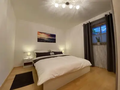 Ein Bett oder Betten in einem Zimmer der Unterkunft Ferienwohnung Tribus