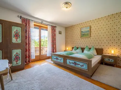 Ein Bett oder Betten in einem Zimmer der Unterkunft Tiroler Gästehaus