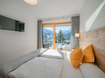 Ein Bett oder Betten in einem Zimmer der Unterkunft Tauern Juwel Top 8