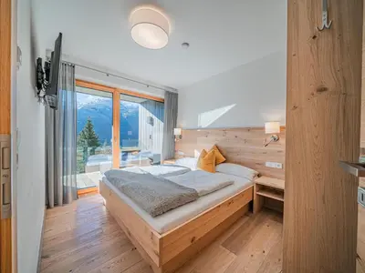 Ein Bett oder Betten in einem Zimmer der Unterkunft Tauern Juwel Top 8