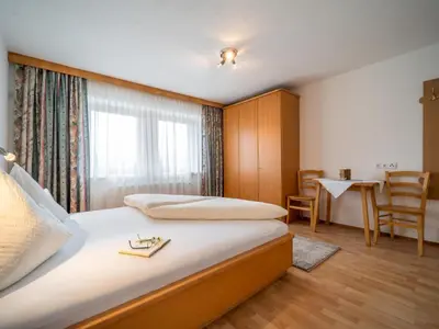 Ein Bett oder Betten in einem Zimmer der Unterkunft Apartment Rohrmoser