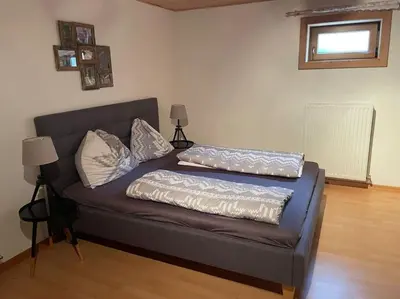 Ein Bett oder Betten in einem Zimmer der Unterkunft Das gemütliche Chalet im Bergdoktordorf Ellmau