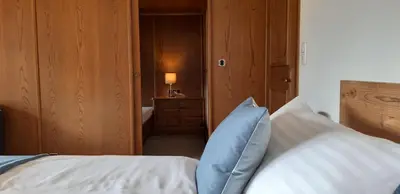 Ein Bett oder Betten in einem Zimmer der Unterkunft Gästehaus Huber