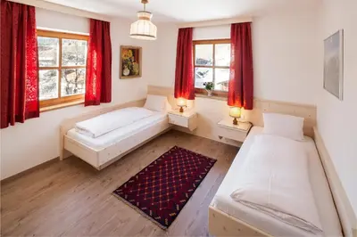 Ein Bett oder Betten in einem Zimmer der Unterkunft Appartementhaus Zum Schneider