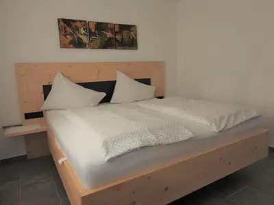 Ein Bett oder Betten in einem Zimmer der Unterkunft Ferienwohnungen Hinterholzer