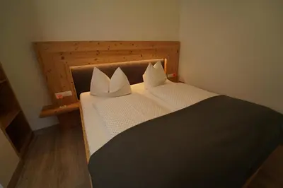 Ein Bett oder Betten in einem Zimmer der Unterkunft Ferienwohnungen Hinterholzer