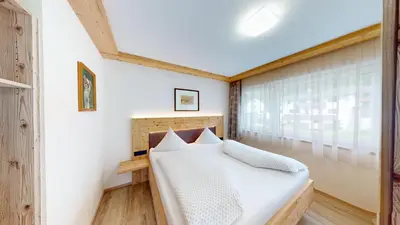 Ein Bett oder Betten in einem Zimmer der Unterkunft Ferienwohnungen Hinterholzer