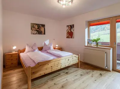 Ein Bett oder Betten in einem Zimmer der Unterkunft Ferienwohnung Schmiderer
