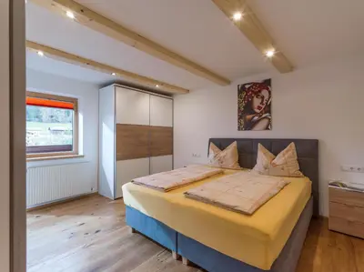Ein Bett oder Betten in einem Zimmer der Unterkunft Ferienwohnung Schmiderer