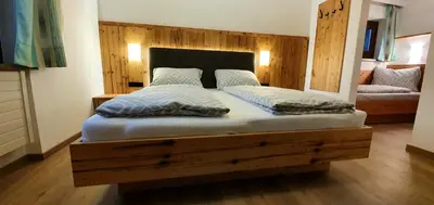 Ein Bett oder Betten in einem Zimmer der Unterkunft Ferienwohnung Kröll