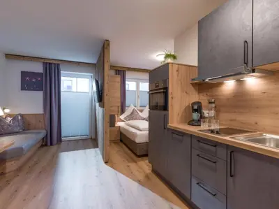 Ein Bett oder Betten in einem Zimmer der Unterkunft Alps Holaus