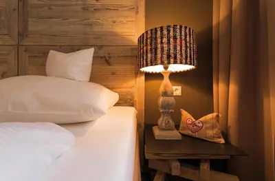 Ein Bett oder Betten in einem Zimmer der Unterkunft Alpenhotel Stefanie