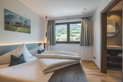 Ein Bett oder Betten in einem Zimmer der Unterkunft Thalhof Apartments